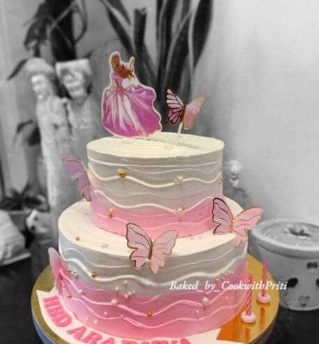 attachment-https://www.bakedbypriti.in/wp-content/uploads/2026/05/Two-Tier-Princess-and-Butterfly-Themed-Cake-458x493.jpeg
