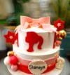 two-tier Barbie-themed birthday cake